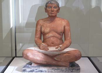 Scribe statuette displayed at the Louvre museum